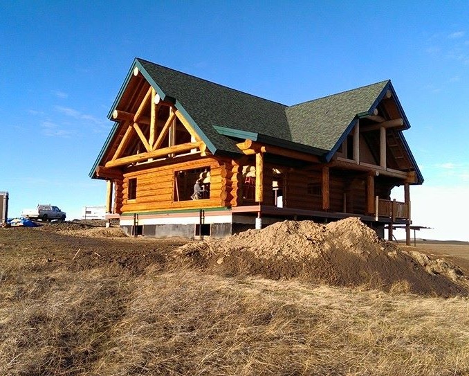 Log cabin on a hillside